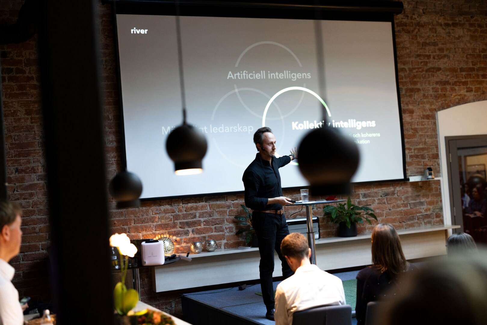 man presenting at company event